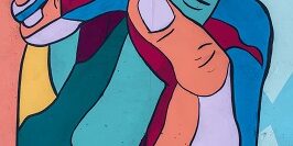 Colorful hands clasped Colorful hands clasped