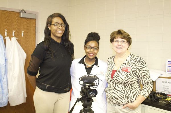 Beth Warning with two high school students