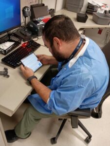 Laboratory professional using a personal phone at work